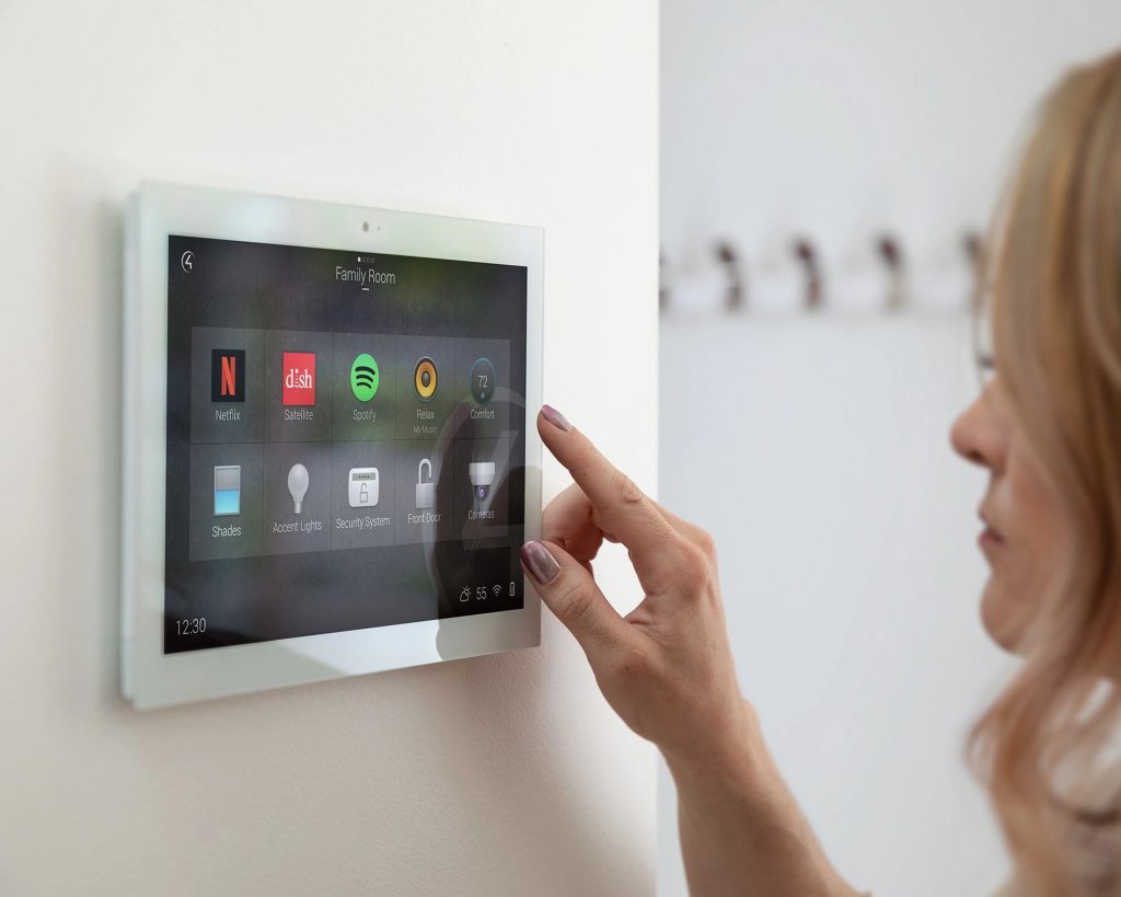 Family room control tablet mounted on a wall