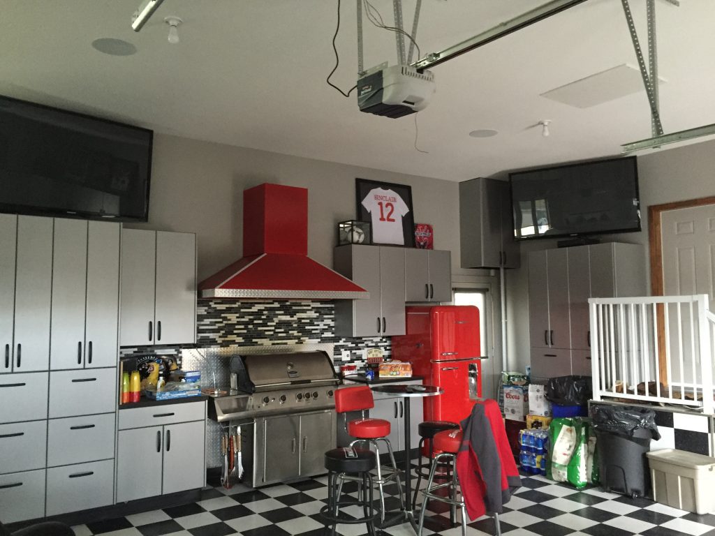 television and speakers mounted in a garage